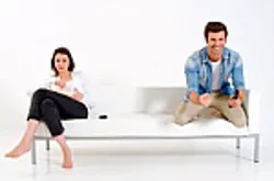 Couple seating on couch